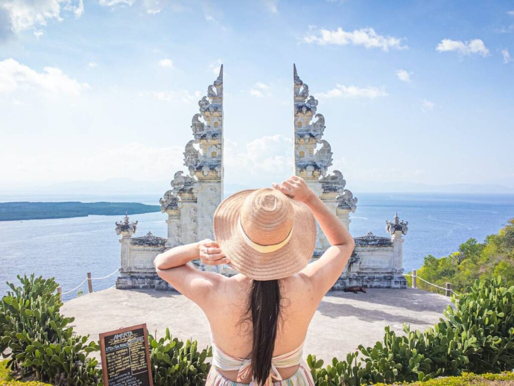 Tourist in Front of Split Gateway of a Temple