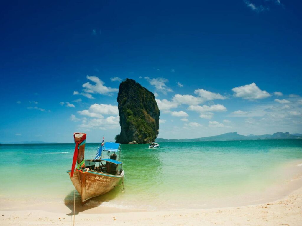Brown on Seashore Near Mountain