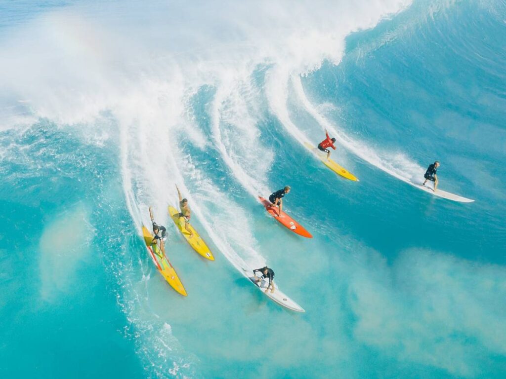 People Surfing on Sea Waves