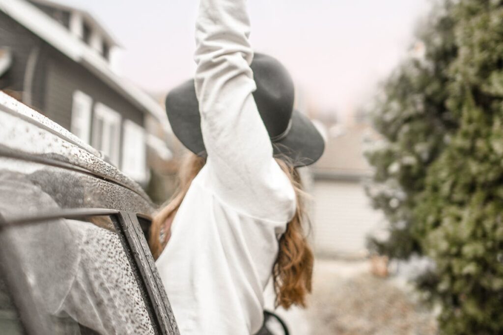 Shallow Focus Photography of Woman in White Top