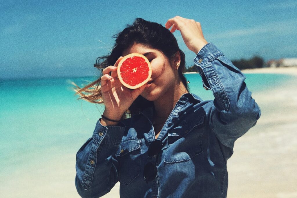 Woman Holding Grapefruit